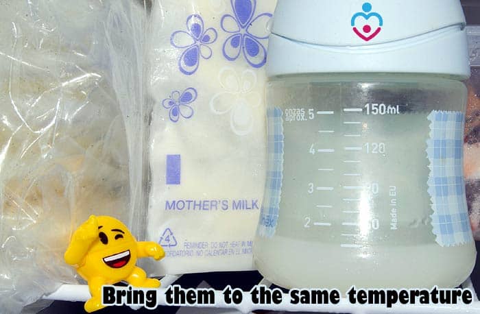 Bring both warm and cold breast milk to the same temperature