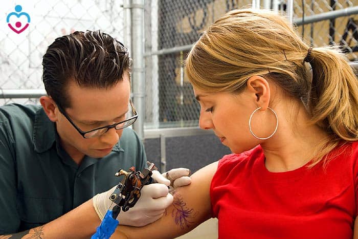 Woman is getting tattooed